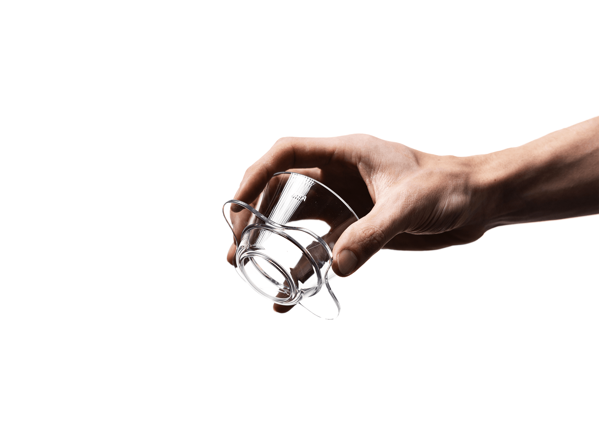 Hand holding the base of the Orea V1 brewer, highlighting the bottom design.