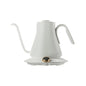 A white Cocinare FLOW M9 Gooseneck Kettle with a digital display and a pot of coffee beans on top, alongside a Cocinare Balance Precision Coffee Scale with a digital display showing weight, on a blue background with scattered coffee beans and a coffee bag.