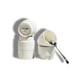 A clean product cutout of stacked white Porland KAT CUPs on a stark white background, with one cup tilted to show the glossy interior and a silver spoon resting inside, perfect for e-commerce display.