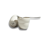 A clean product cutout on a stark white background of two white Roaster Kat KatCup Omnis, featuring one upright cup holding a silver spoon and one tilted cup displaying the "KAT CUP PORLAND" circular stamp on its base.