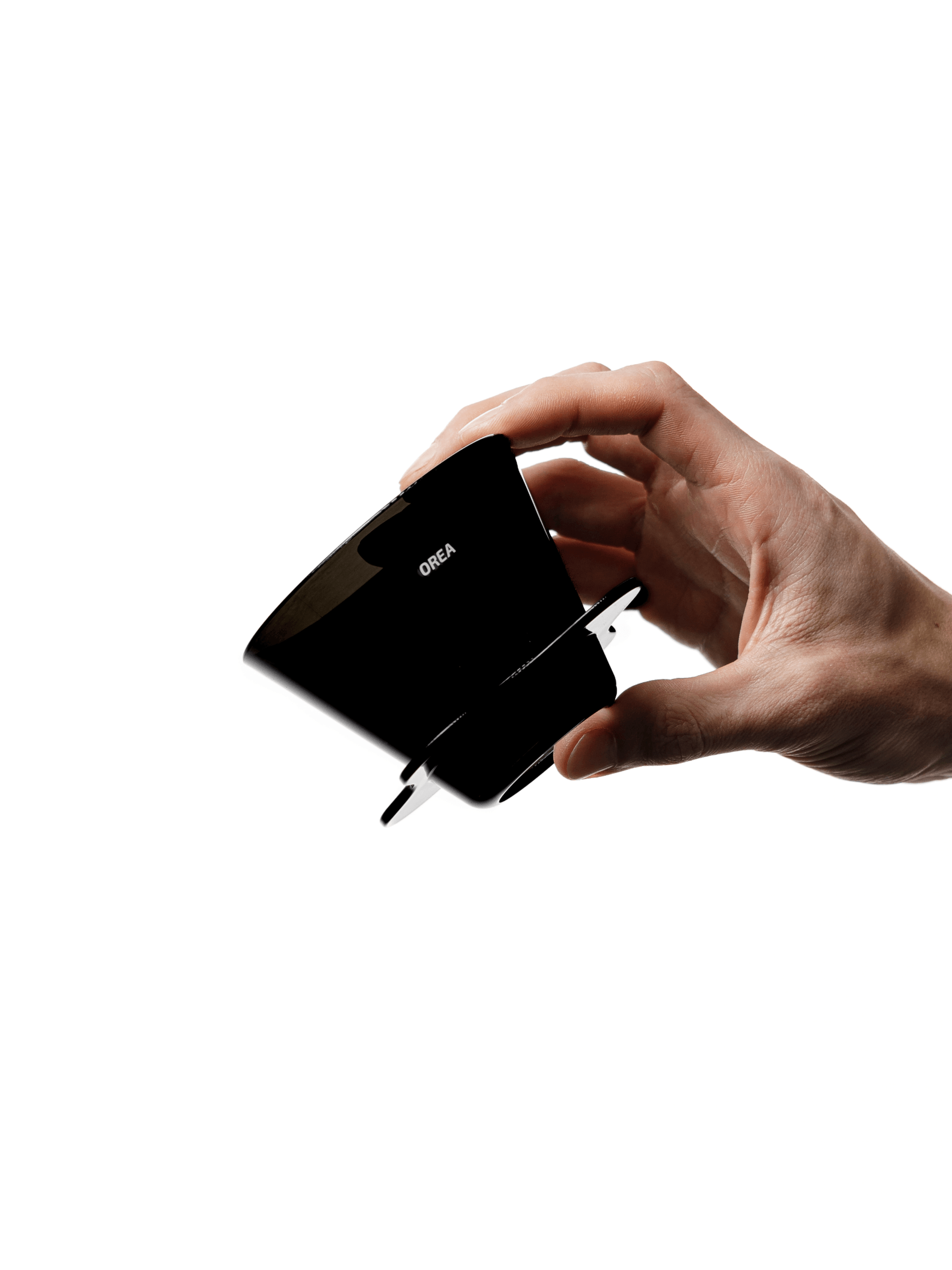 A hand comfortably holding the compact, 67g OREA O2 Darth Black Brewer on a pure white background, showcasing its ergonomic, one-piece design and beautiful glossy black finish.