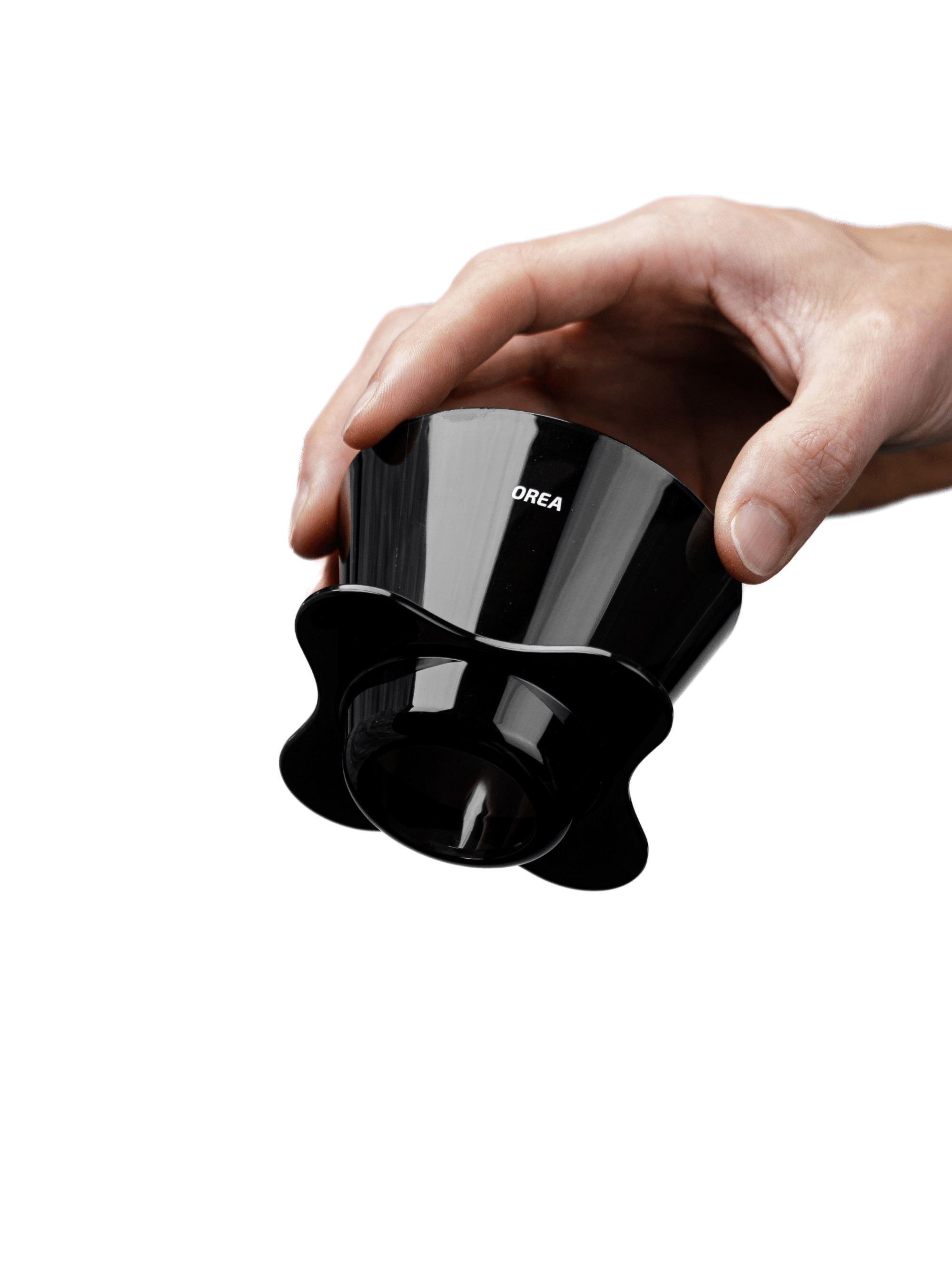 A clean product shot of a hand holding the OREA O2 Darth Black Brewer upright, displaying the white OREA logo and the 7.5cm tall, single-piece Eastman Tritan body.