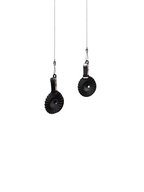 A split-panel studio shot of two black OREA #4 Medium Regulators suspended by metal clips on thin wires against a seamless white background, highlighting the sleek, industrial design of these silicone flow-control discs.