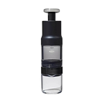 A clean, high-resolution studio shot of the fully assembled OXO Brew Rapid Brewer featuring its sleek black, clear, and stainless steel design, ready to brew rich, concentrated coffee from Somewhere Coffee's Colombian single-origin beans.