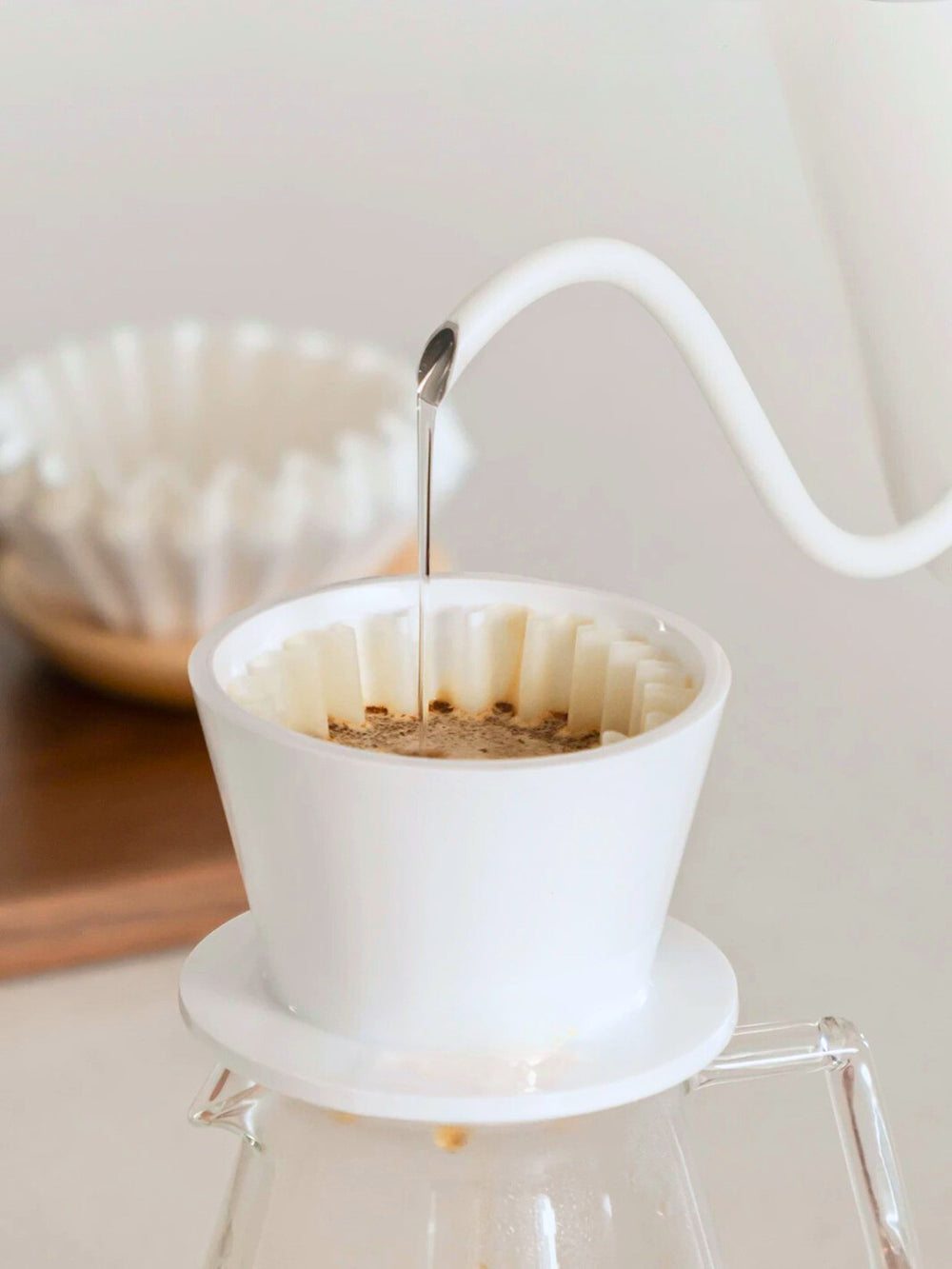 White Timemore Crystal Eye B75 ceramic dripper brewing coffee with drip drawdown during pour-over