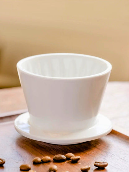 Timemore Crystal Eye B75 white ceramic pour-over dripper with coffee beans on display