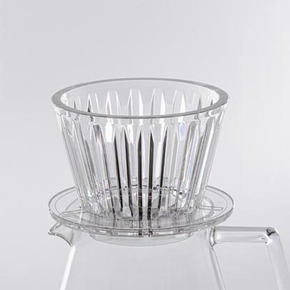 Detailed close-up of the Timemore Crystal Eye B75 dripper, showcasing the precision-molded plastic finish and the distinctive crystal eye pattern on the exterior.